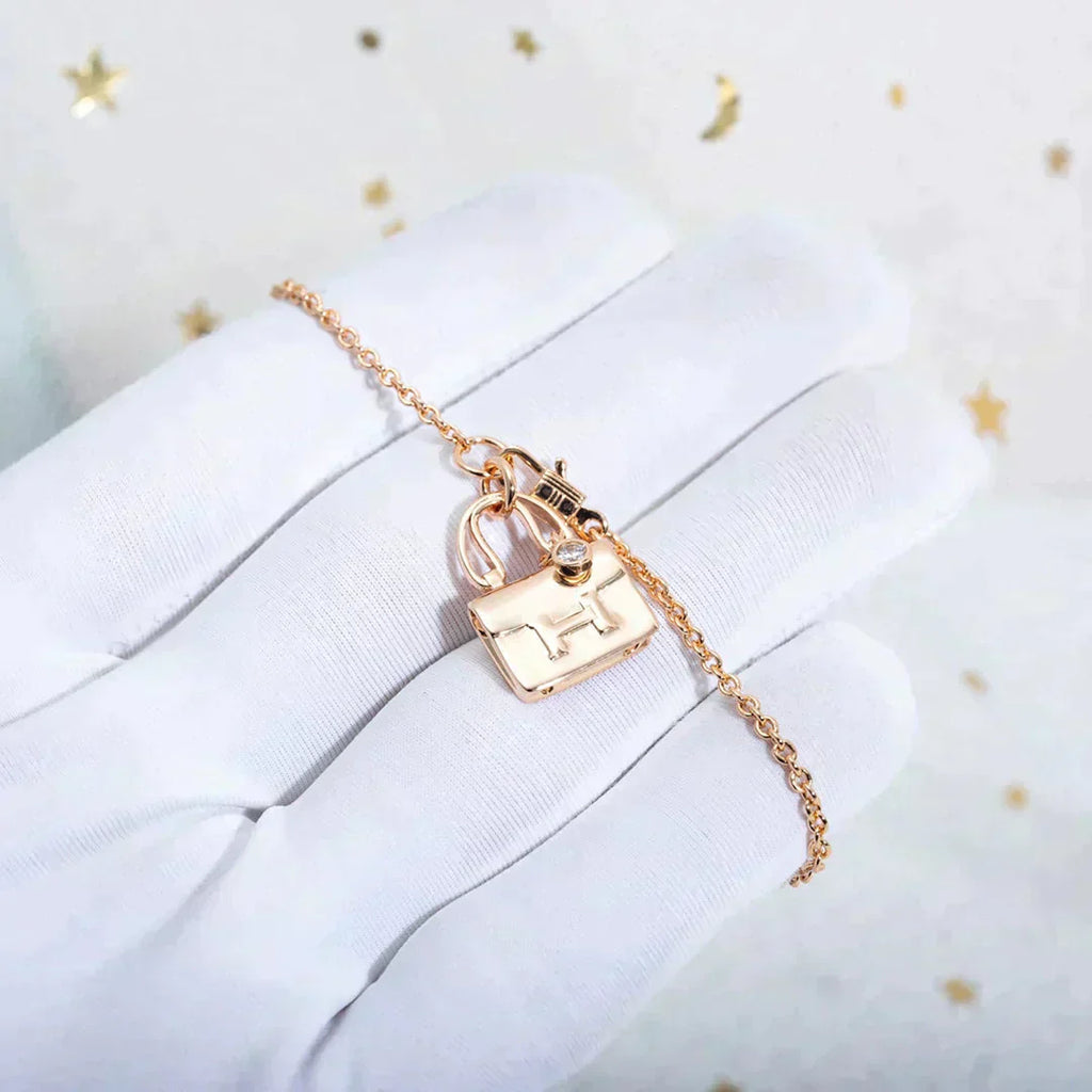 HERMES AMULETTE PEDANT ROSE GOLD NECKLACE